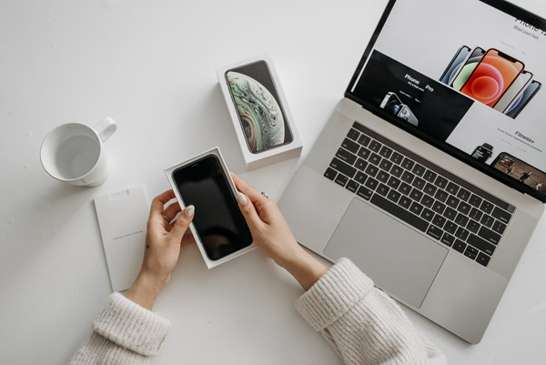 pov-phone-laptop-white-desk__opdb-op61dd70a34d9981-72620389