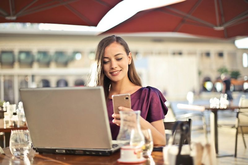 woman-happy-smile-computer-laptop-cafe-phone__opdb-op6026c00a590113-38686126
